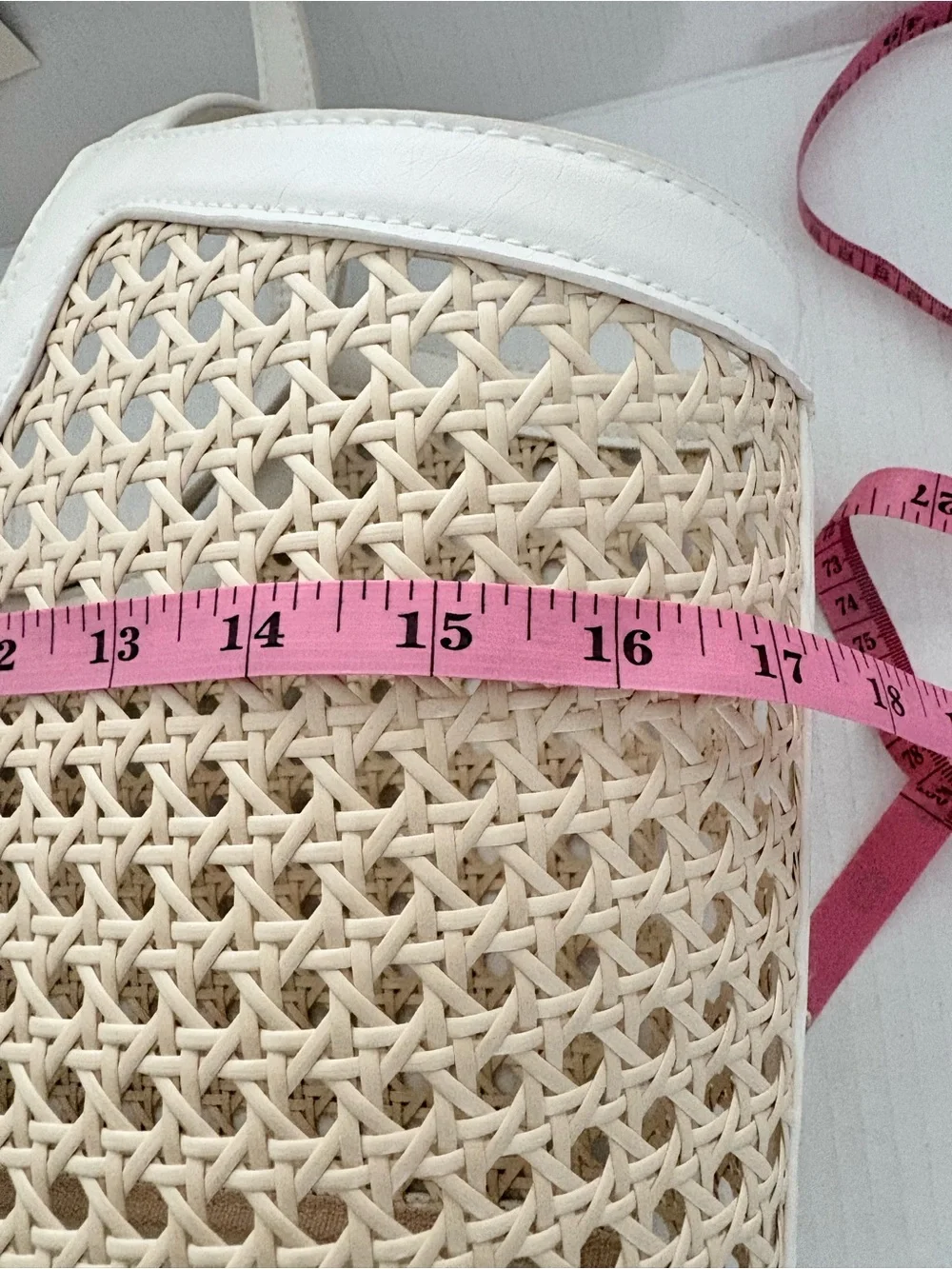 A New Day Straw Caning Tote Bag natural woven cane design white trim detailing.
